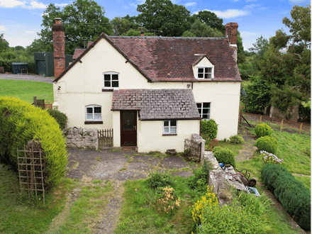 Two bedroom semi-detached stone cottage sitting within approximately two acres of grounds