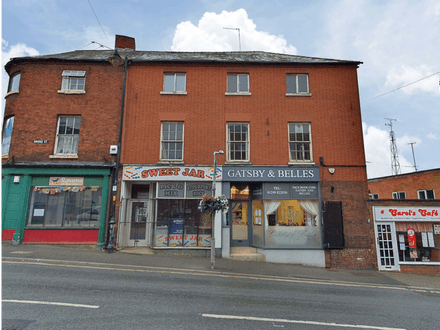 Potential annual income of £30,000. A mixed retail and residential investment opportunity comprising two shops with vacant upper floors having planning permission in place to develop into four one bedroom flats.